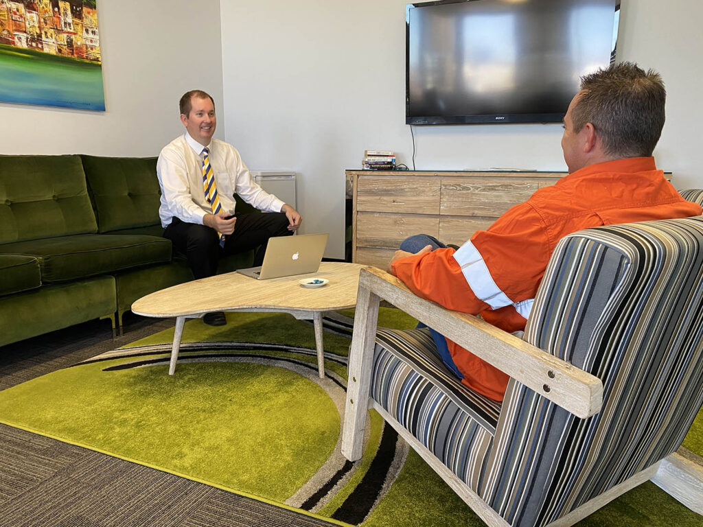 Mike Mackenzie explaining his client on how to get a construction home loan in Perth