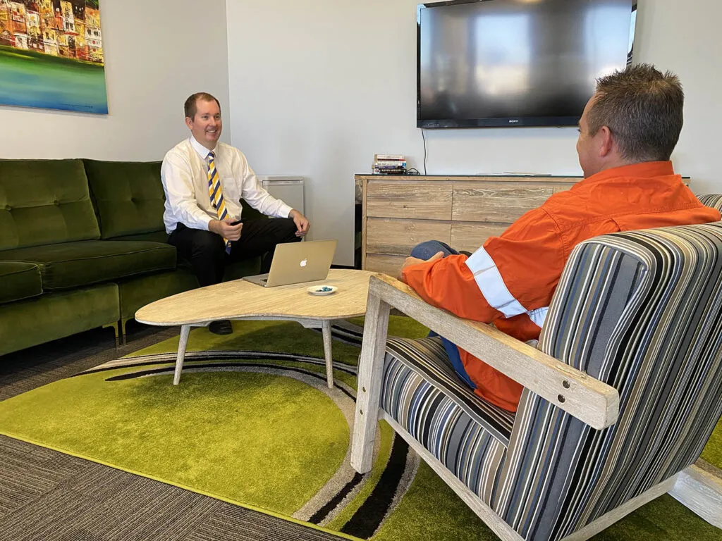 Mike Mackenzie explaining his client on how to get a construction home loan in Perth