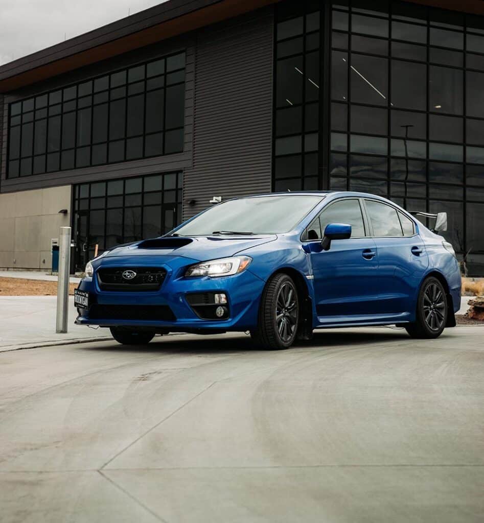 A blue Subaru WRX bought with a car loan, parked in a Perth carpark